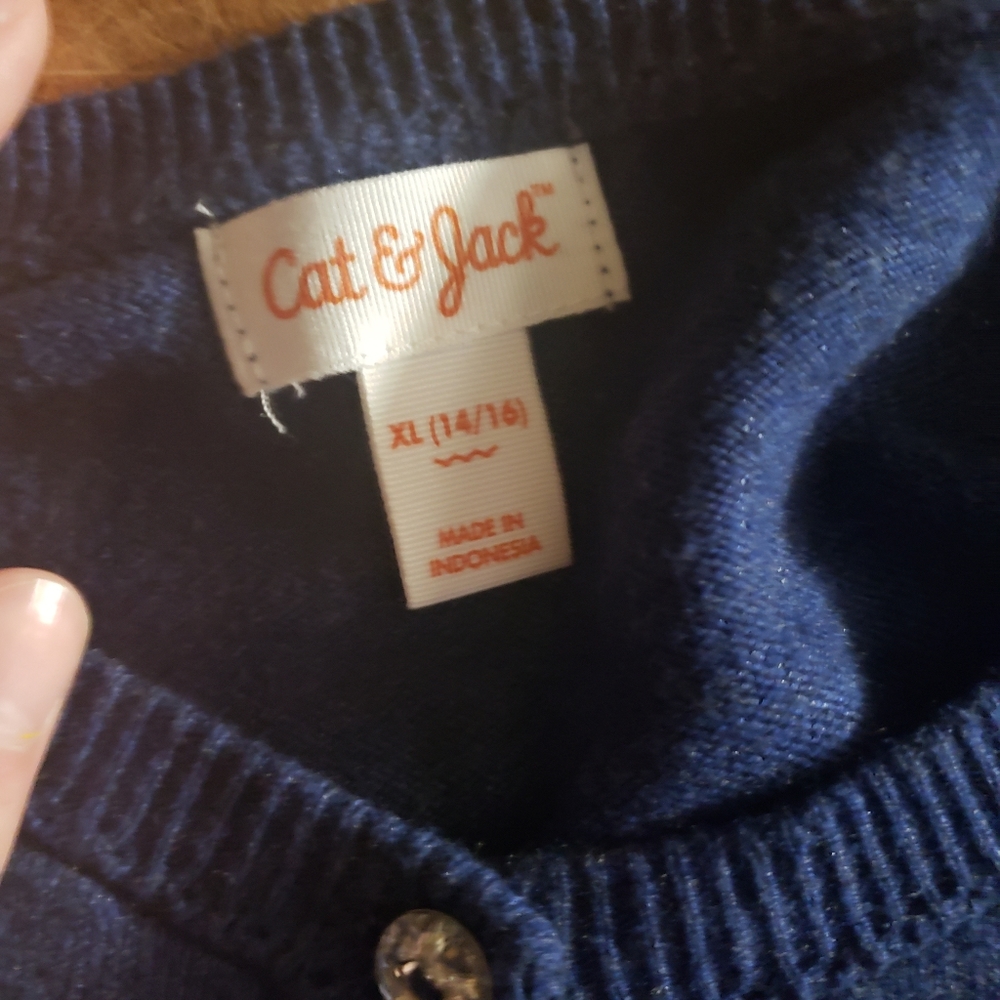 Gem buttons with a button up shirt that is navy blue